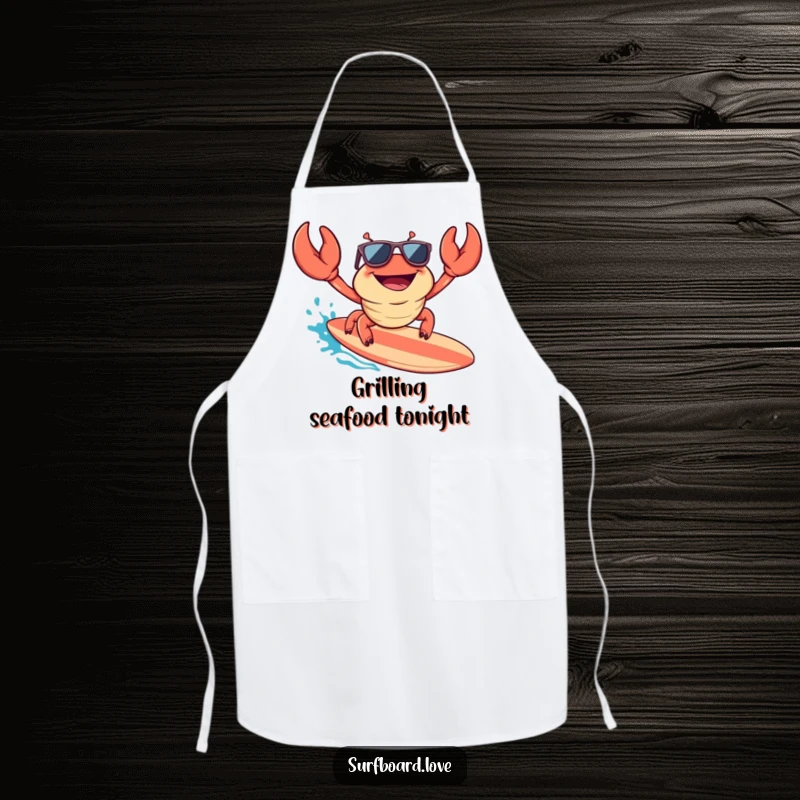 Funny apron with a happy crab wearing sunglasses, surfing a surfboard, bringing a cool and humorous beachy feel to kitchen tasks.