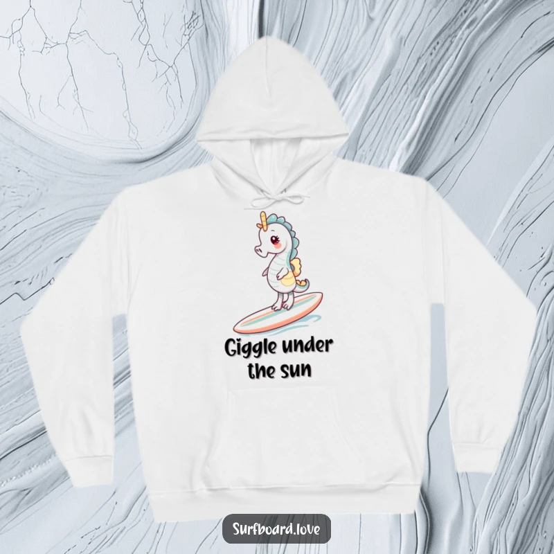 Funny giggling seahorse struggling to balance on a surfboard, depicted on a soft, warm hoodie.